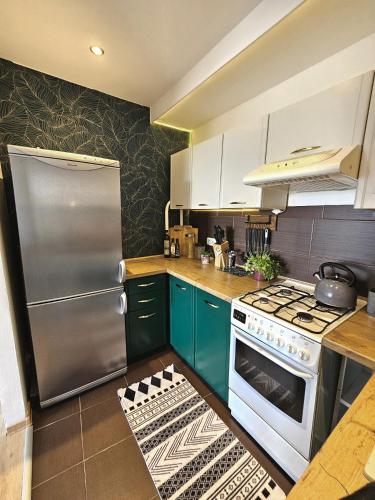 Η κουζίνα ή μικρή κουζίνα στο Apartament Błękitny Horyzont, Klimatyzacja