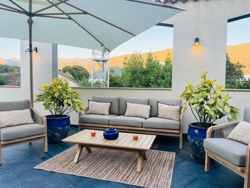 a living room with couches and a coffee table at Résidence COMAEM in Sarrola-Carcopino