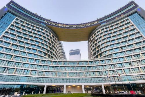 a large building with a lot of windows at Popular Seven Palm Apartments in Dubai