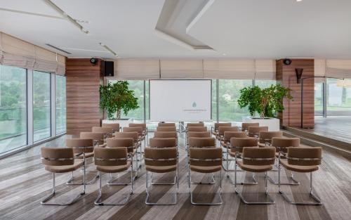 a room with a row of chairs and a screen at Lankaran Springs Wellness Resort in Lankaran