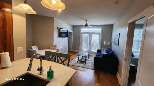 a kitchen and living room with a sink and a living room at #2107 - 2 bedroom, LSU Stadium, sleeps 6 in Baton Rouge