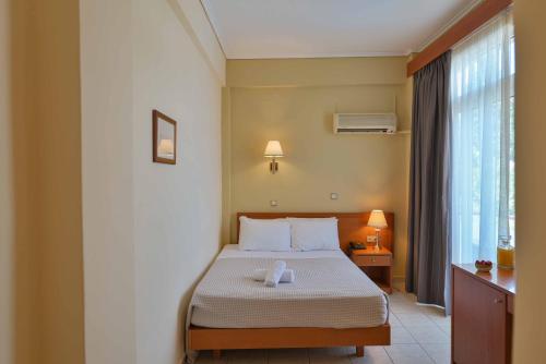 Postel nebo postele na pokoji v ubytování Neda Hotel