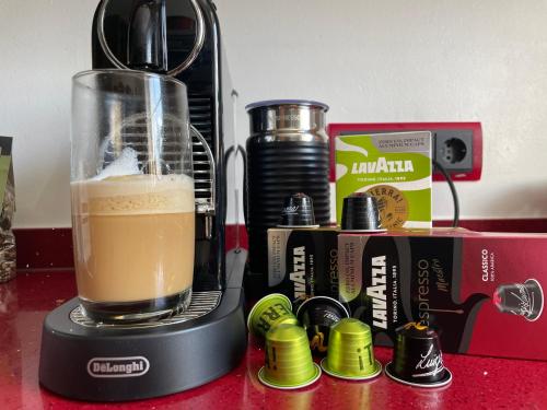 a blender with a drink in it on a counter at Ferienwohnung Annika in Hückeswagen