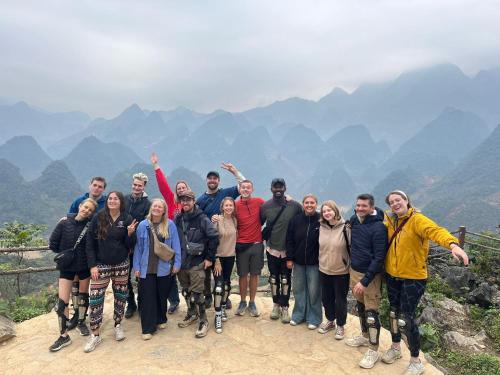 a group of people standing on top of a mountain at Đồng Văn Golden Hotel in Dồng Văn