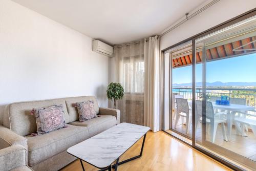 a living room with a couch and a table at UHC SANTILLANA FAMILY COMPLEX in Salou