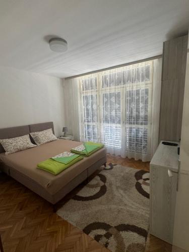 Postel nebo postele na pokoji v ubytování Andjela’s Apartment