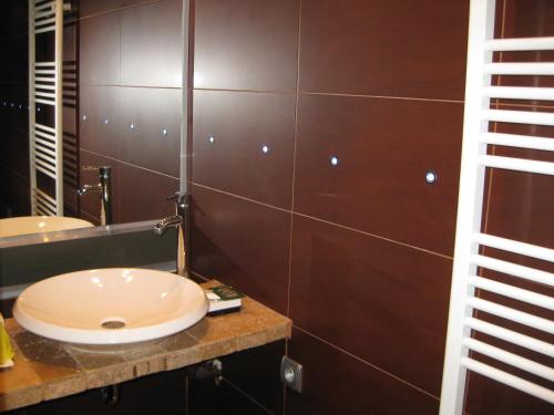 a bathroom with a sink and a mirror at La Villa Blanche in Marseille