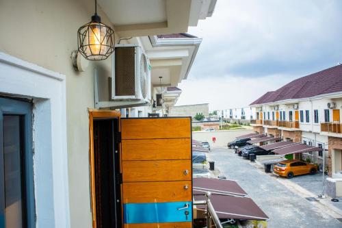 a view of a building with dressers and a parking lot at Cozy 2Bed Terraced Duplex Apartment in Ajah-Lekki in Aja