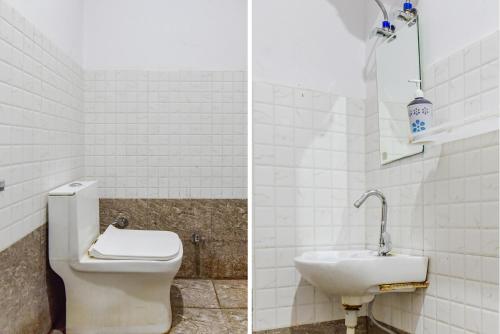 デヘラードゥーンにあるFabHotel The Bird Houseのトイレと洗面台付きのバスルーム