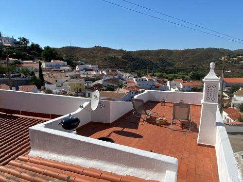 a view of a city from the roof of a house at Blue Dragon River House in Odeleite
