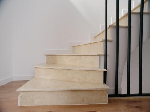 a set of concrete stairs with black railings at DoubleS Maison 1 in Cluj-Napoca