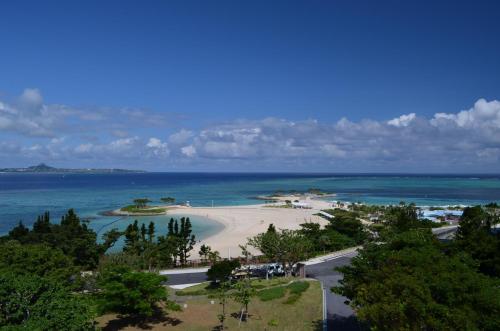 an aerial view of a beach in the ocean at Guest House Isa in Motobu
