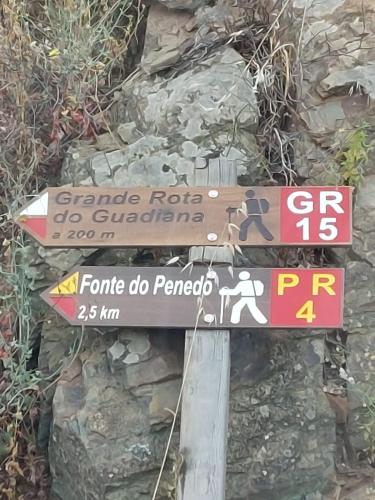 a street sign on the side of a mountain at Blue Dragon River House in Odeleite