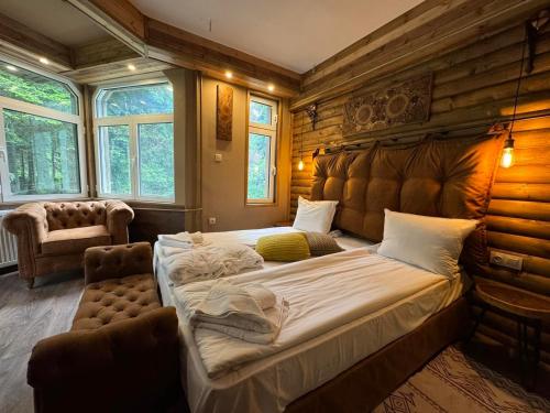 a bedroom with a large bed in a room at The Forest Villa Borovets by BookVillaBG in Borovets