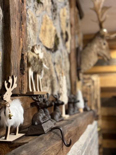 a shelf with figurines of animals on it at The Forest Villa Borovets by BookVillaBG in Borovets
