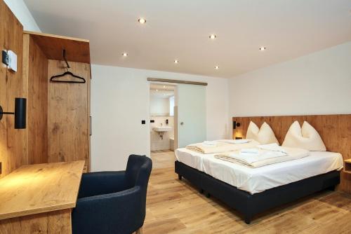 Postel nebo postele na pokoji v ubytování Alpen-Hotel Seimler
