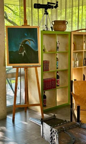 a painting of a bull on a stand at Artemisia Boutique Hotel in Bastelica