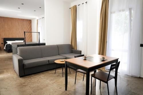 a living room with a couch and a table at La Peonia B&B in Ragusa
