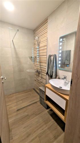 a bathroom with a sink and a shower at Lana Del Capos in Saints Constantine and Helena