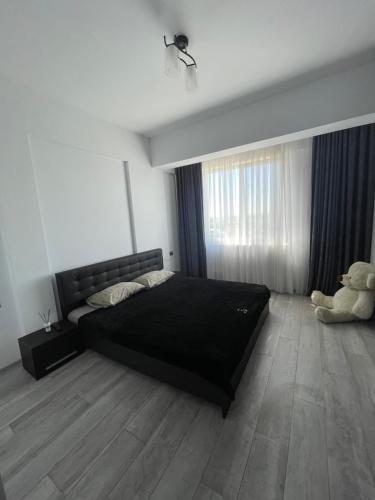 En eller flere senge i et værelse på Apartament Mamaia Nord