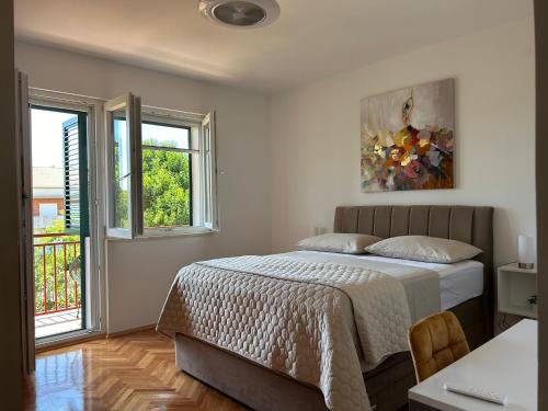 Ένα ή περισσότερα κρεβάτια σε δωμάτιο στο Apartman MARITA