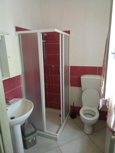 a bathroom with a toilet and a sink at Valery AffittaCamere in Capannori