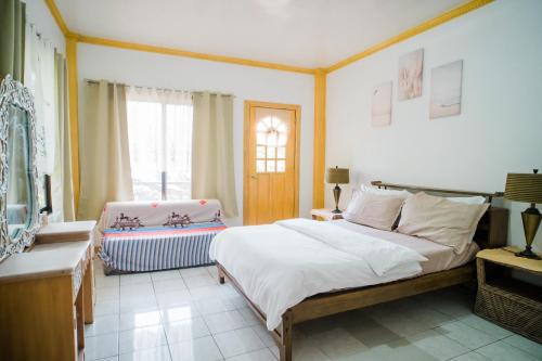 Ένα ή περισσότερα κρεβάτια σε δωμάτιο στο Danao RM House