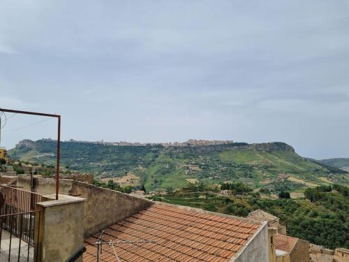 a view of a valley from a roof of a building at Obelisco Apartment Calascibetta in Calascibetta
