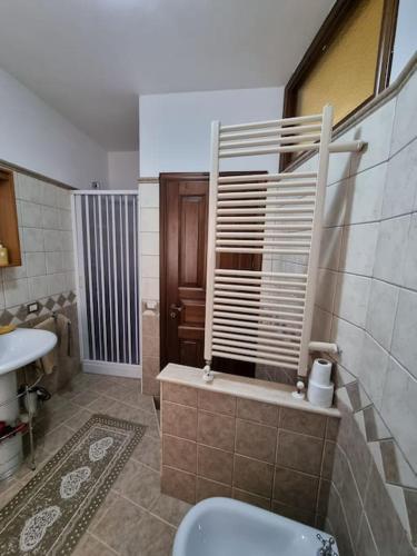 a bathroom with a toilet and a sink at Obelisco Apartment Calascibetta in Calascibetta