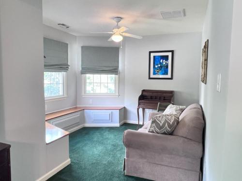a living room with a couch and a table at River Gem: Spacious 4 Bdrm Beach House 2 Blocks to Beach in Colonial Beach