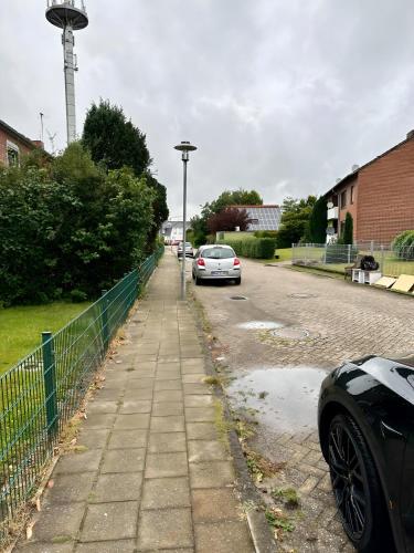 a car parked on the side of a street at Apartment NeuenHOUSE II Garten & Ruhig in Neuenhaus