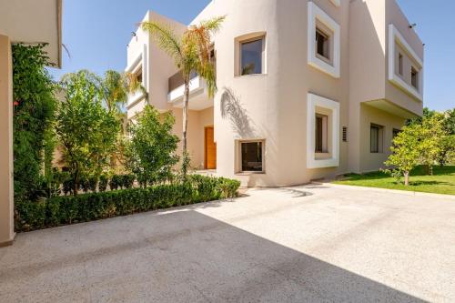 an exterior view of a white building at ZT 36 by Majestic Properties in Marrakech