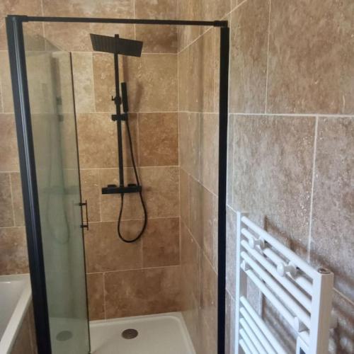 a shower with a glass door in a bathroom at Bastide 3 chambres 6personnes avec piscine sur Aix en Provence in Aix-en-Provence