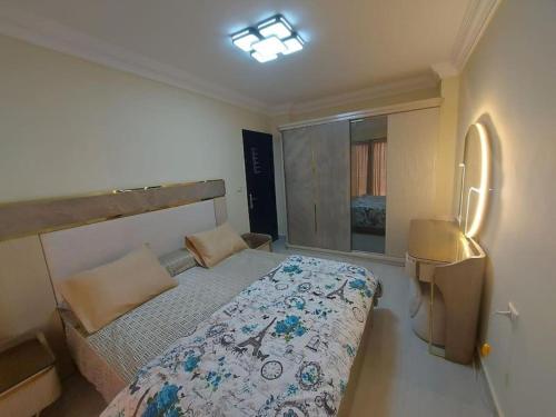 a small bedroom with a bed and a window at La Sirena Palm Families only in Ain Sokhna