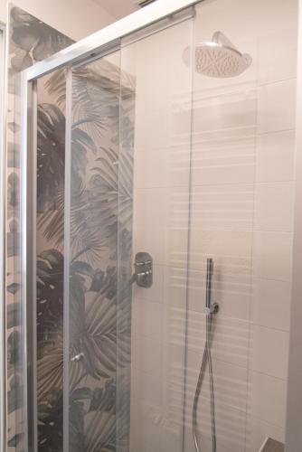 a bathroom with a shower with a glass door at Tra il Borgo e il Lago in Lovere