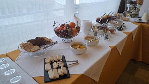 a table with a buffet of food on it at Archontiko Tzoumerkon in Agnanta