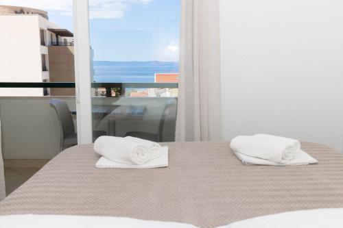 Posteľ alebo postele v izbe v ubytovaní Vidoš apartments