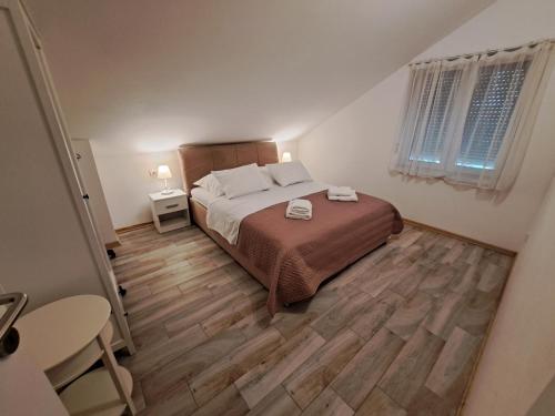 Postel nebo postele na pokoji v ubytování Apartment Queen