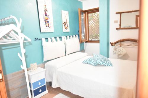 a bedroom with a bed and a bunk bed at Villa Giada in Domus de Maria