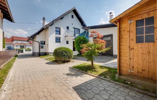 a brick driveway in front of a house at Nice Home In Stubicke Toplice in Stubicke Toplice