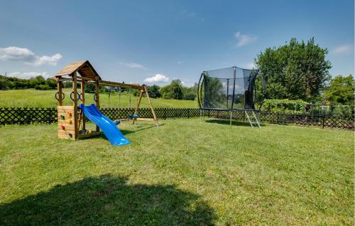 a playground with a slide and a swing at Nice Home In Stubicke Toplice in Stubicke Toplice
