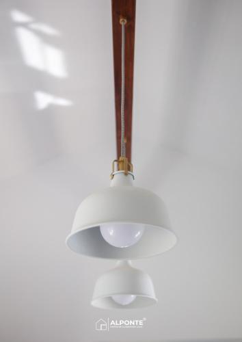 a white ceiling light hanging from a ceiling at Quinta da Costeira - Casa Azul do Limoal by ALPONTE in Arcos de Valdevez
