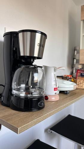 a blender sitting on a shelf in a kitchen at Little house near the beach in Áyioi Apóstoloi