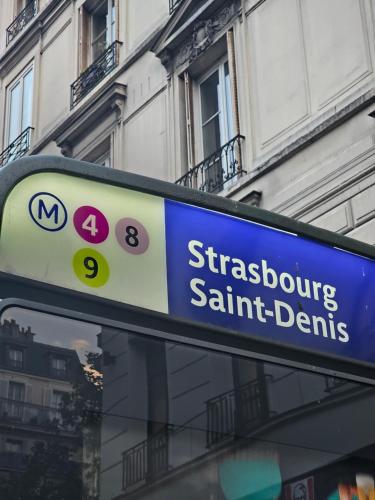a blue street sign on top of a bus at Korean Style Minbak Number Two PARIS in Paris
