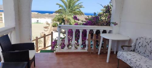 a room with a balcony with a view of the beach at BlueMar in Almería