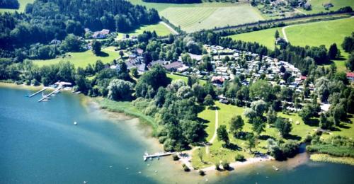 an aerial view of a village on a lake at Stella's Holzchalet in Seekirchen am Wallersee