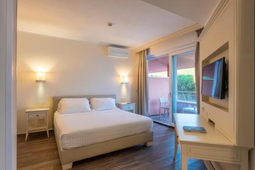 Boutique Hotel Torre Di Cala Piccolaにあるベッド
