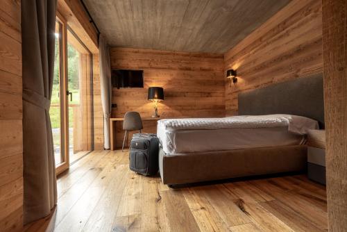 Ένα ή περισσότερα κρεβάτια σε δωμάτιο στο Chalet Pandora Bivio Travel