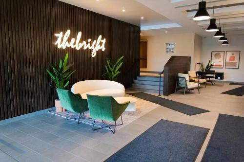 a lobby with chairs and a sign that reads audiologist at 2bhk Luxury brand new pvt suite Kitchener in Kitchener