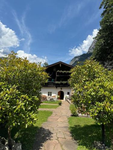 a house with a pathway leading to it with trees at Jagerbauerngut in Wimm
